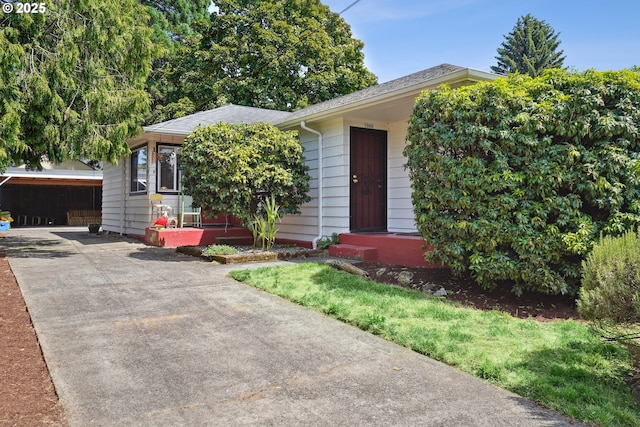 1304 NE 79th Ave, Portland, OR 97213 - obstructed view of property with a shingled roof and concrete driveway