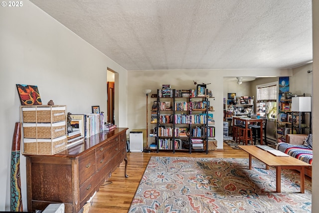 1304 NE 79th Ave, Portland, OR 97213 - living area with a textured ceiling, wood finished floors, and a ceiling fan