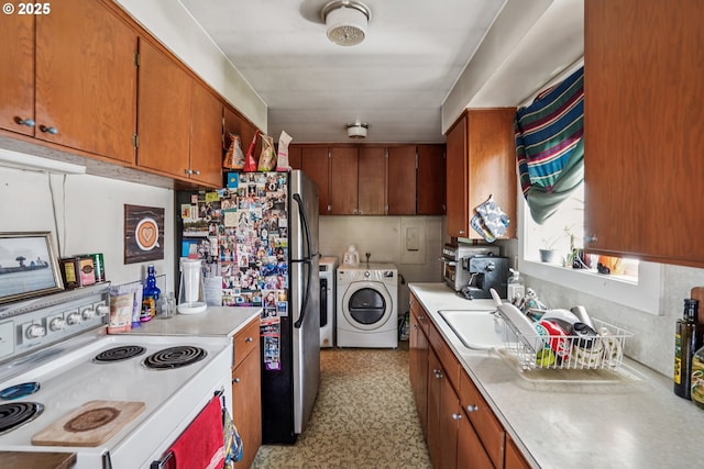 1304 NE 79th Ave, Portland, OR 97213 - kitchen featuring white electric range oven, independent washer and dryer, light countertops, brown cabinetry, and freestanding refrigerator
