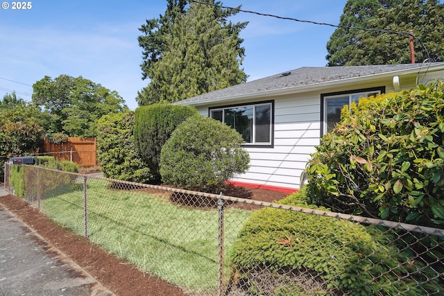 1304 NE 79th Ave, Portland, OR 97213 - view of home's exterior with a fenced backyard and a shingled roof