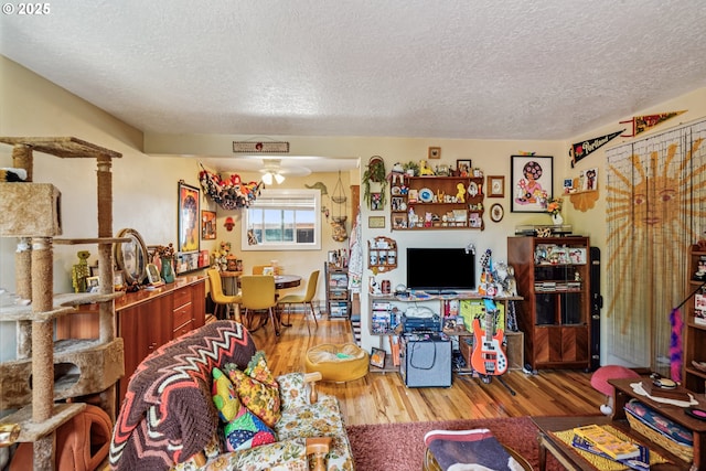 1304 NE 79th Ave, Portland, OR 97213 - living room featuring a textured ceiling, wood finished floors, and a ceiling fan