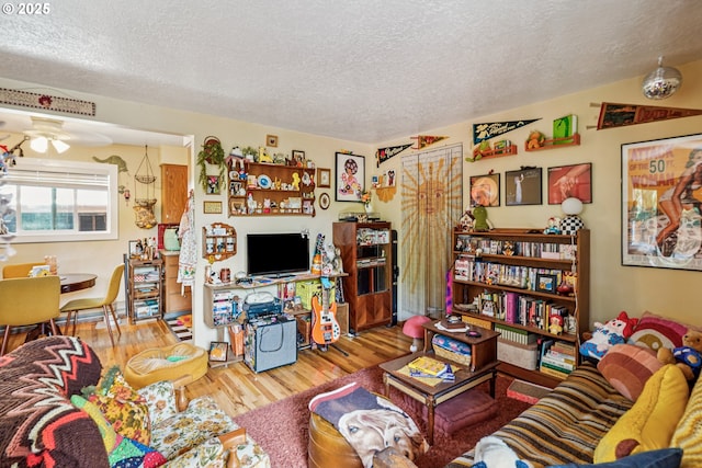 1304 NE 79th Ave, Portland, OR 97213 - living area featuring a textured ceiling, wood finished floors, and a ceiling fan