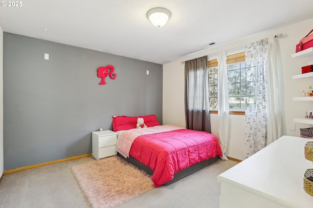 carpeted bedroom with a textured ceiling