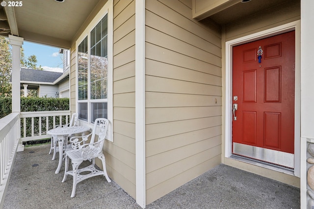 property entrance with covered porch