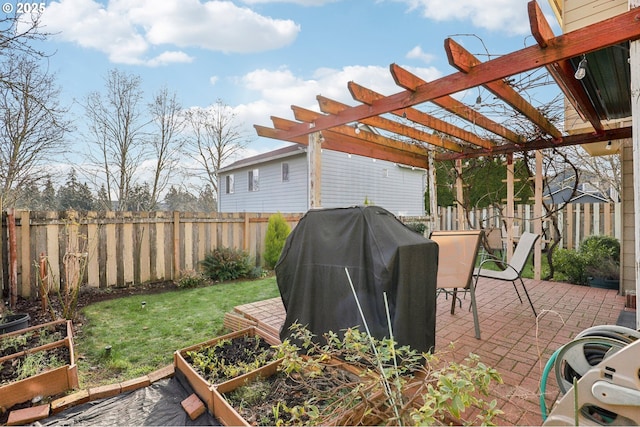 view of patio / terrace featuring area for grilling and a pergola