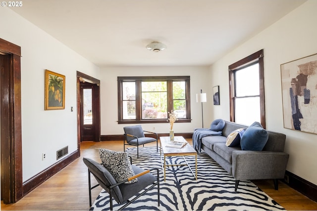 1818 N Killingsworth St, Portland, OR 97217 - living room featuring wood finished floors and baseboards