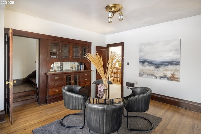 1818 N Killingsworth St, Portland, OR 97217 - living area featuring light wood-style floors, baseboards, and stairs