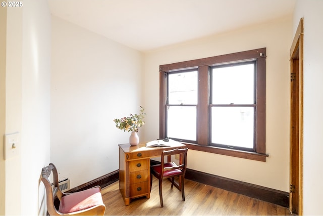 1818 N Killingsworth St, Portland, OR 97217 - office area with light wood-style floors and baseboards