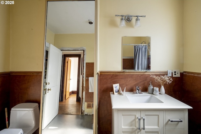 1818 N Killingsworth St, Portland, OR 97217 - full bath with vanity, toilet, a wainscoted wall, and a shower with shower curtain