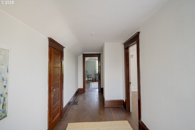 1818 N Killingsworth St, Portland, OR 97217 - hall featuring dark wood-type flooring, baseboards, and vaulted ceiling