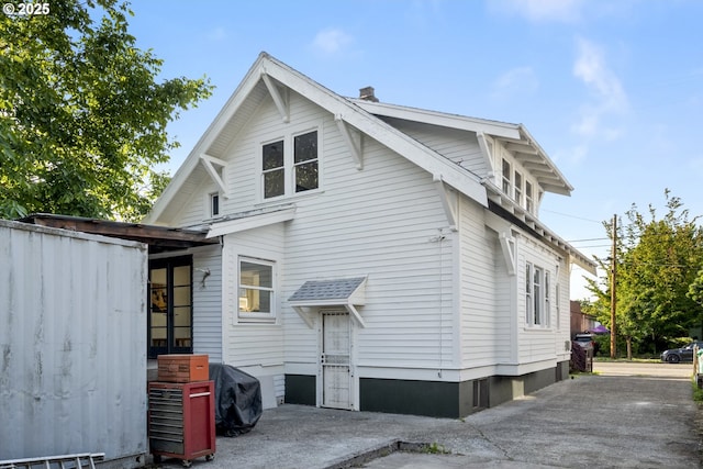 1818 N Killingsworth St, Portland, OR 97217 - rear view of property featuring a chimney