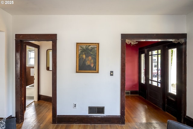 1818 N Killingsworth St, Portland, OR 97217 - foyer entrance with hardwood / wood-style flooring, baseboards, and healthy amount of natural light
