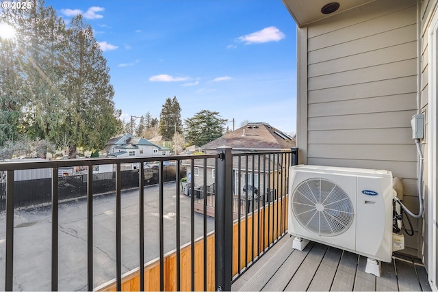 balcony featuring ac unit and a residential view