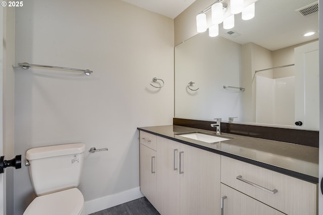 full bathroom featuring baseboards, visible vents, vanity, and toilet