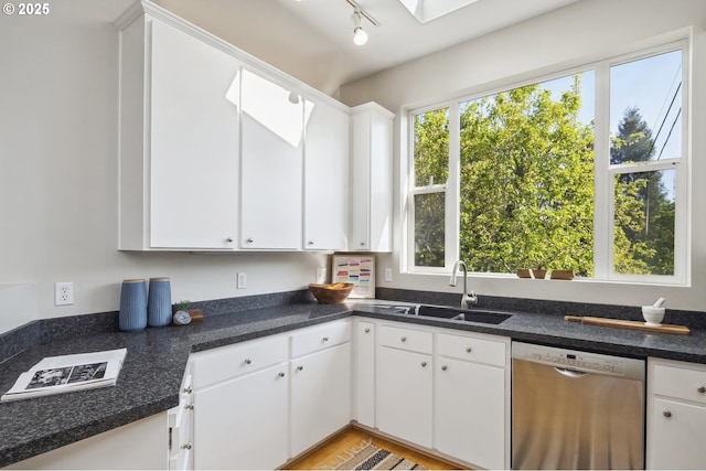 1369 SW Broadway Dr, Portland, OR 97201 - kitchen featuring dishwasher, a sink, and white cabinetry