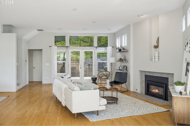 1369 SW Broadway Dr, Portland, OR 97201 - living area with french doors, a fireplace with flush hearth, and light wood finished floors