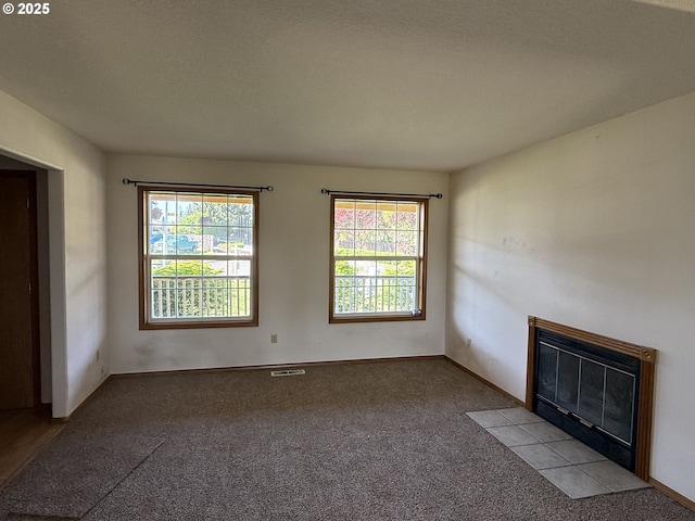 16117 NE 87th St, Vancouver, WA 98682 - unfurnished room with plenty of natural light, a fireplace with flush hearth, and carpet flooring