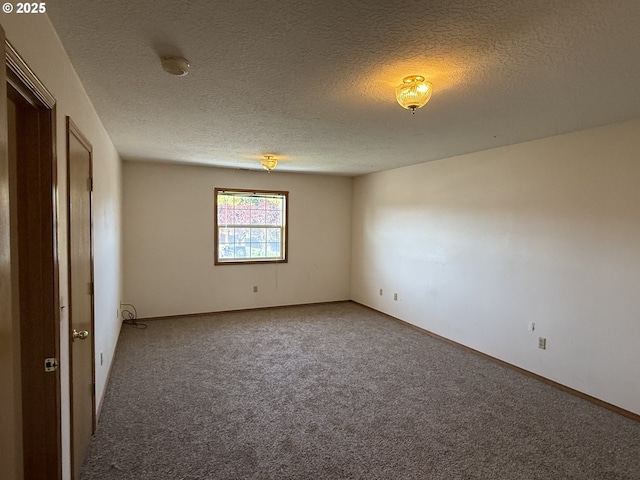 16117 NE 87th St, Vancouver, WA 98682 - carpeted spare room with a textured ceiling, baseboards, and a smoke detector