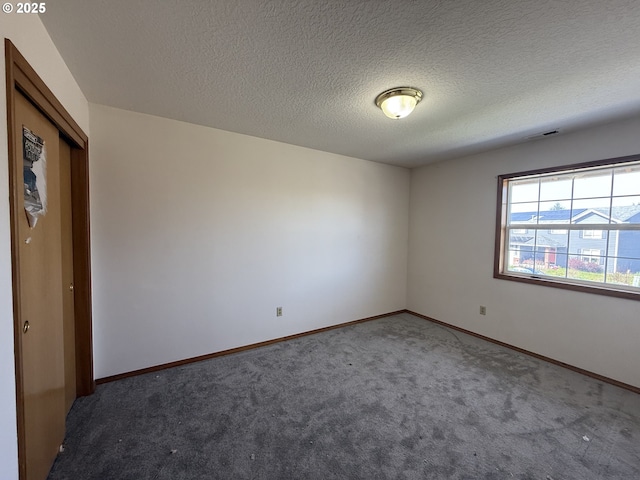 16117 NE 87th St, Vancouver, WA 98682 - spare room featuring carpet, baseboards, and a textured ceiling