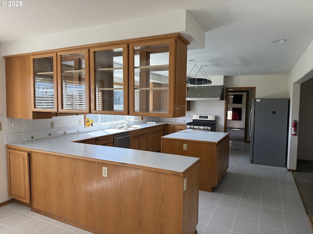 16117 NE 87th St, Vancouver, WA 98682 - kitchen with appliances with stainless steel finishes, light tile patterned flooring, glass insert cabinets, light countertops, and brown cabinetry