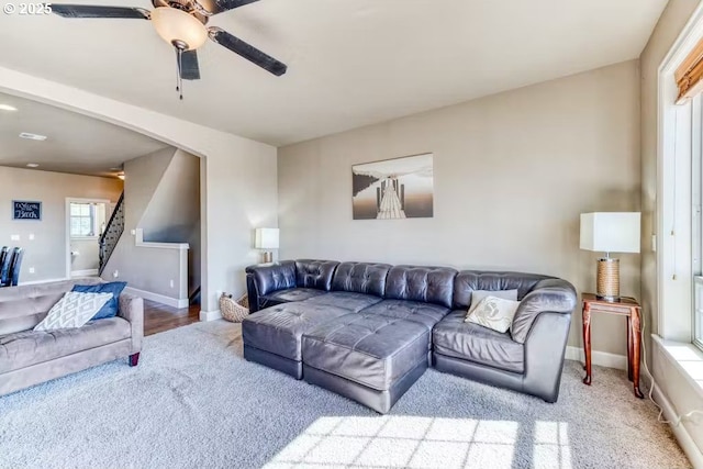 547 Front St, Rockaway Beach, OR 97136 - living room with light colored carpet and ceiling fan