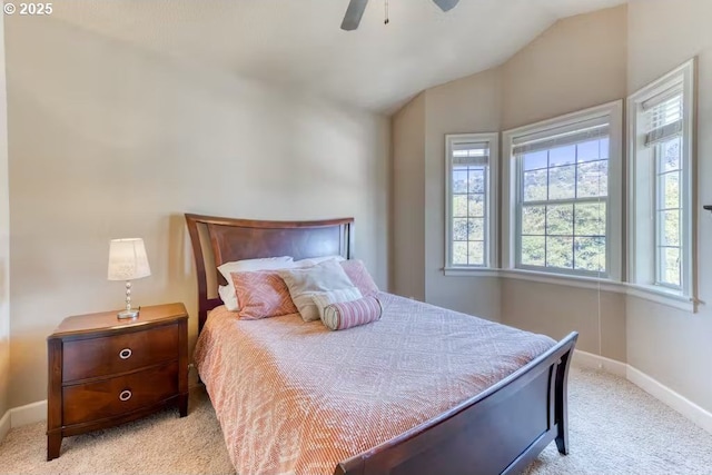 547 Front St, Rockaway Beach, OR 97136 - carpeted bedroom featuring multiple windows, vaulted ceiling, and ceiling fan