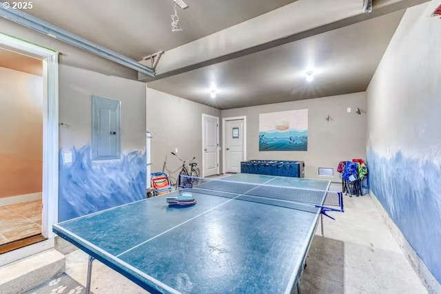 547 Front St, Rockaway Beach, OR 97136 - rec room with electric panel and concrete flooring
