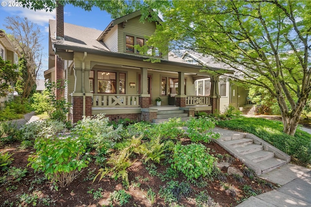 2603 NE 11th Ave, Portland, OR 97212 - view of front of house with a porch, a chimney, and brick siding