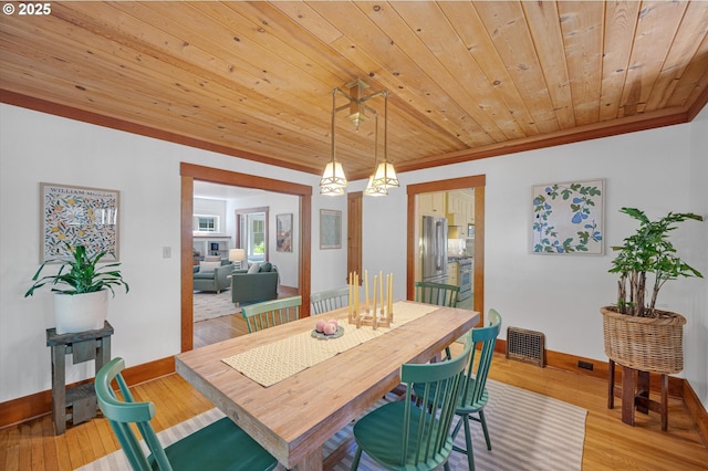 2603 NE 11th Ave, Portland, OR 97212 - dining room featuring wood ceiling, light wood finished floors, and crown molding
