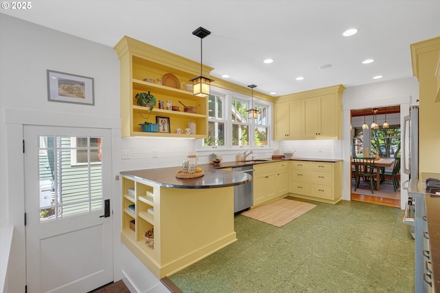 2603 NE 11th Ave, Portland, OR 97212 - kitchen with stainless steel dishwasher, open shelves, decorative backsplash, hanging light fixtures, and cream cabinetry