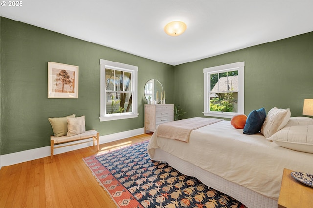 2603 NE 11th Ave, Portland, OR 97212 - bedroom featuring wood finished floors and baseboards