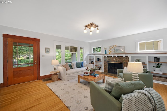 2603 NE 11th Ave, Portland, OR 97212 - living room with plenty of natural light, wood finished floors, and a fireplace
