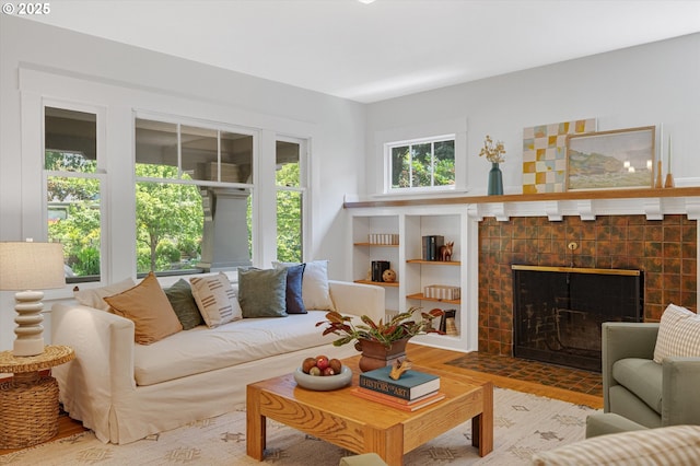 2603 NE 11th Ave, Portland, OR 97212 - living room with a tiled fireplace and wood finished floors