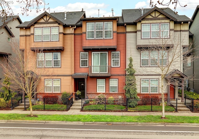 multi unit property featuring a fenced front yard