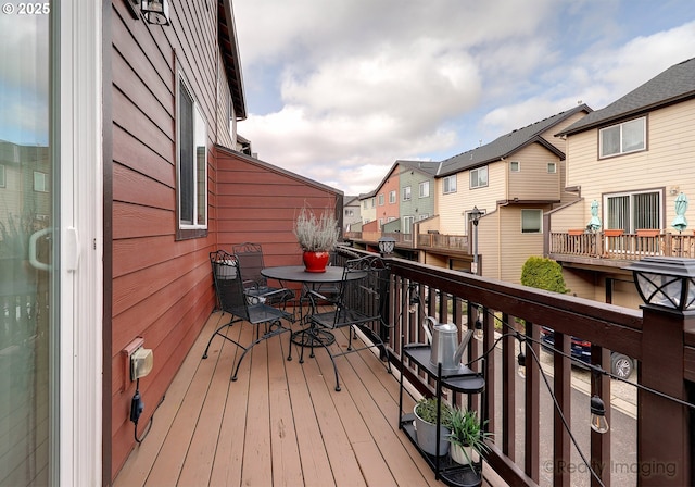 wooden terrace with a residential view