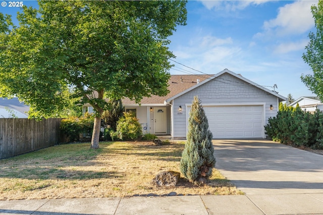 1230 W Fairview Dr, Springfield, OR 97477 - view of front of property featuring concrete driveway, a garage, and a shingled roof