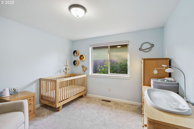 1230 W Fairview Dr, Springfield, OR 97477 - carpeted bedroom featuring a sink and a nursery area