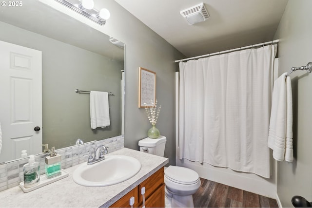 1230 W Fairview Dr, Springfield, OR 97477 - bathroom featuring vanity, wood finished floors, decorative backsplash, and shower / tub combo with curtain