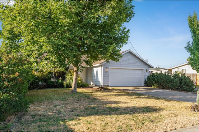 1230 W Fairview Dr, Springfield, OR 97477 - view of front facade featuring concrete driveway, a garage, and a front lawn