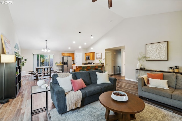 1230 W Fairview Dr, Springfield, OR 97477 - living room with light wood-style flooring, a chandelier, high vaulted ceiling, a ceiling fan, and recessed lighting