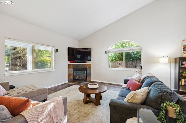 1230 W Fairview Dr, Springfield, OR 97477 - living room with wood finished floors, plenty of natural light, a tile fireplace, and high vaulted ceiling