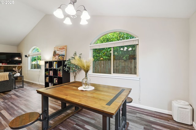 1230 W Fairview Dr, Springfield, OR 97477 - dining room with vaulted ceiling, a chandelier, and wood finished floors