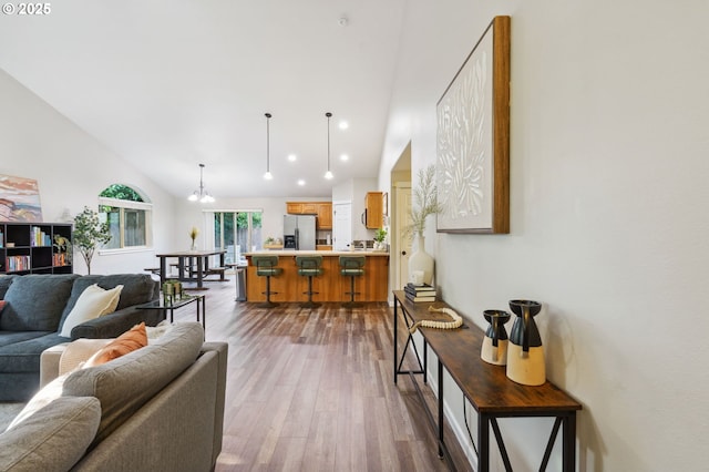 1230 W Fairview Dr, Springfield, OR 97477 - living area featuring dark wood-style flooring, recessed lighting, a chandelier, and high vaulted ceiling