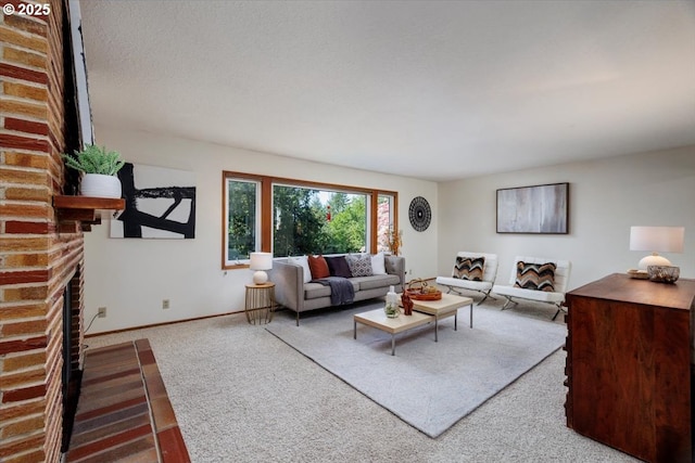 carpeted living room featuring baseboards and a fireplace