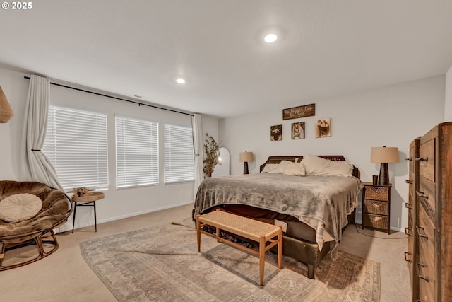 bedroom featuring light carpet, recessed lighting, and baseboards