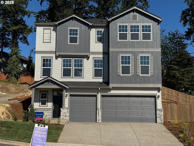 view of front of home with a garage, stone siding, and board and batten siding