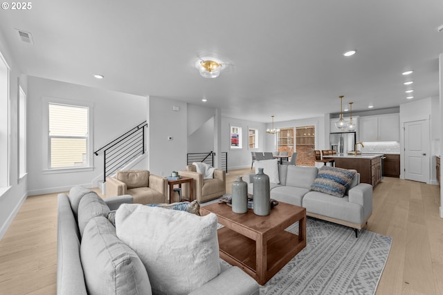2134 Eleanor Rd, West Linn, OR 97068 - living room featuring stairway, light wood finished floors, recessed lighting, and baseboards