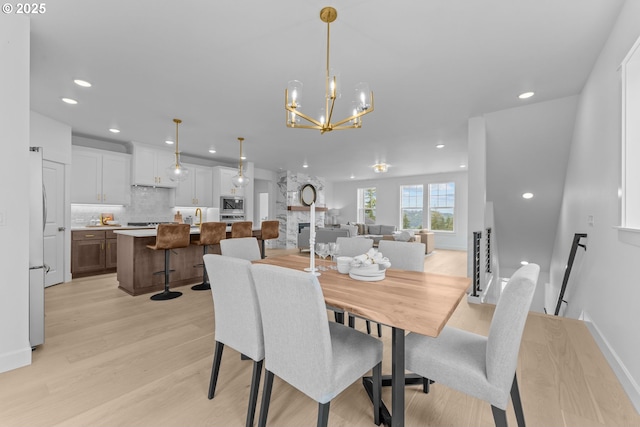2134 Eleanor Rd, West Linn, OR 97068 - dining room featuring light wood-style floors, a chandelier, and recessed lighting