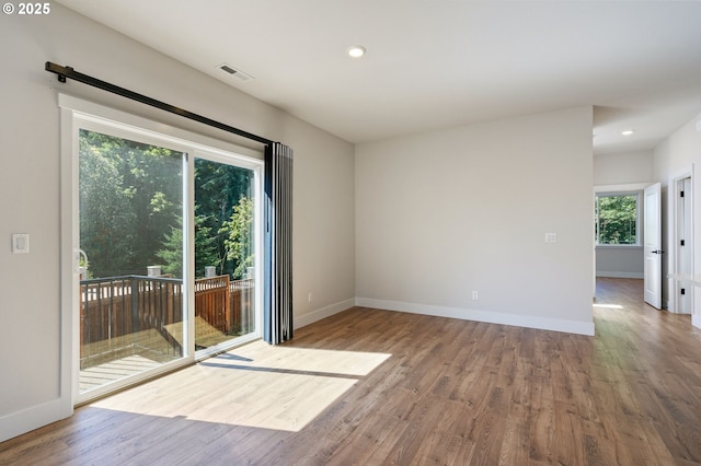 16735 SW Darling Ln, Portland, OR 97224 - empty room with wood finished floors and recessed lighting