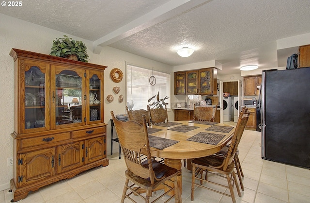 6510 NE 52nd St, Vancouver, WA 98661 - dining space featuring independent washer and dryer, light tile patterned flooring, and a textured ceiling